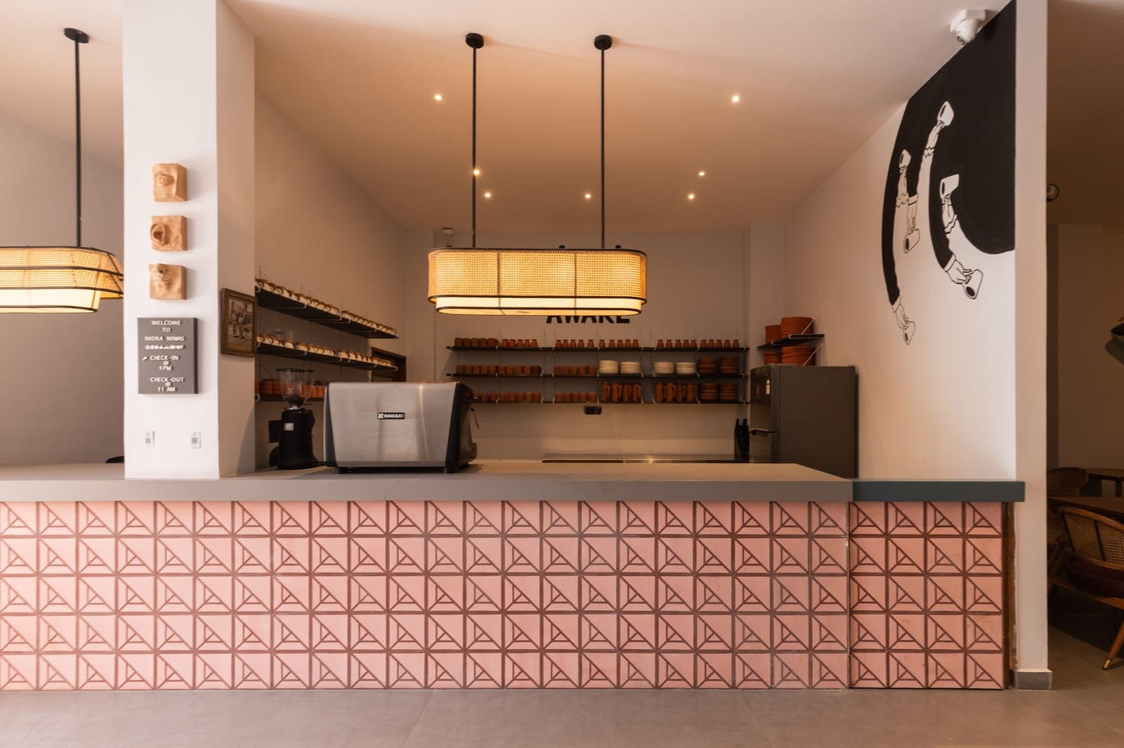 Café Awake counter with espresso machine and terracotta cups — boutique hotel café in Jaipur